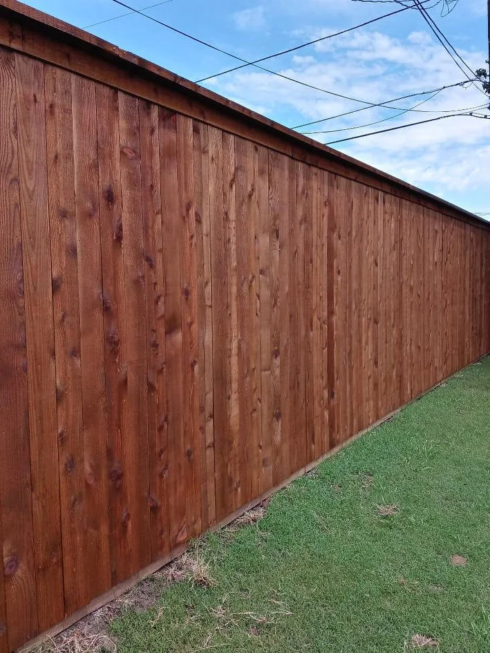 Tall finished wood privacy fence